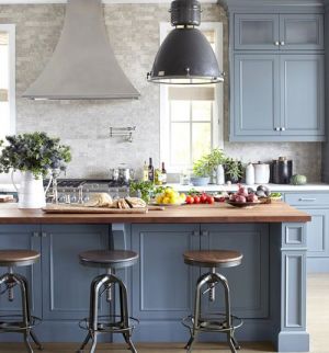 house beautiful kitchen black pendant light blue grey cabinets turn stools.jpg